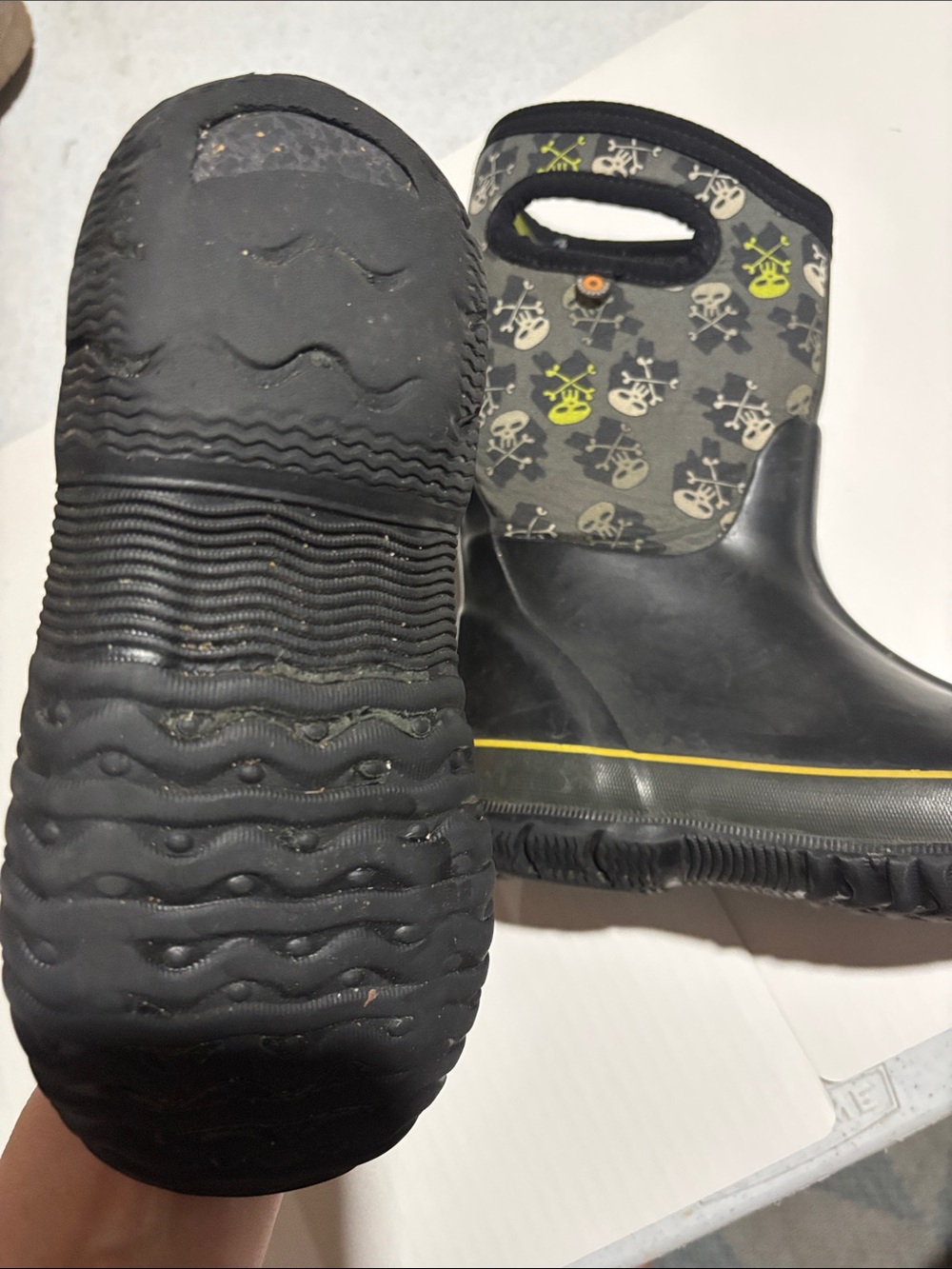 Bogs Black Kids Rain Boots with Skull Pattern and Yellow Trim